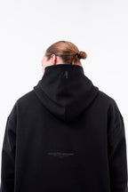 Hoodie Oversized Essentials · Negro