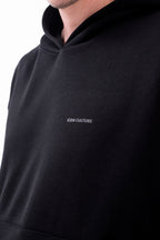 Hoodie Oversized Essentials · Negro