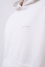 Hoodie Oversized Essentials · Blanco Hueso