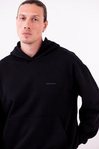 Hoodie Oversized Essentials · Negro